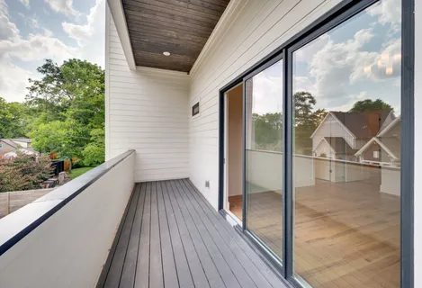 a view of a balcony with wooden floor