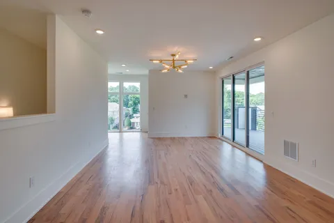 a view of balcony with wooden floor