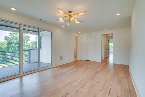 a bathroom with a double vanity sink mirror and shower