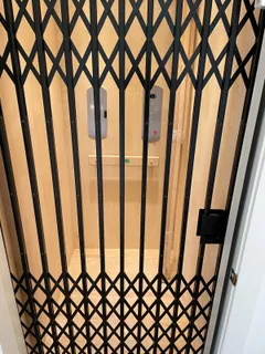 a view of a room with wooden floor and a window