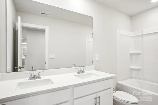a bathroom with a sink toilet tub and shower