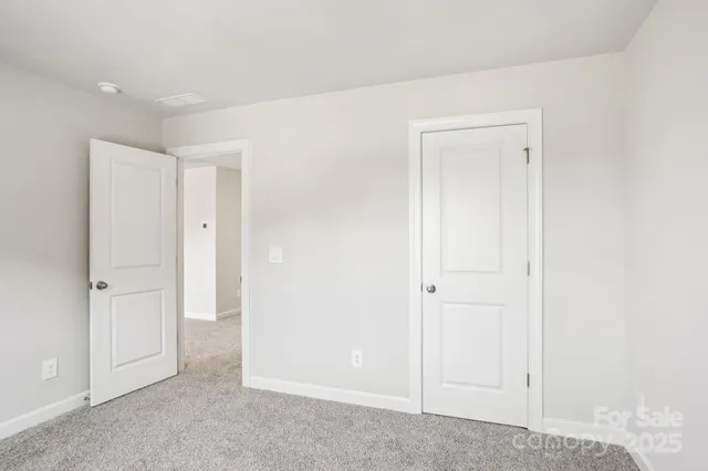 an empty room with closet area