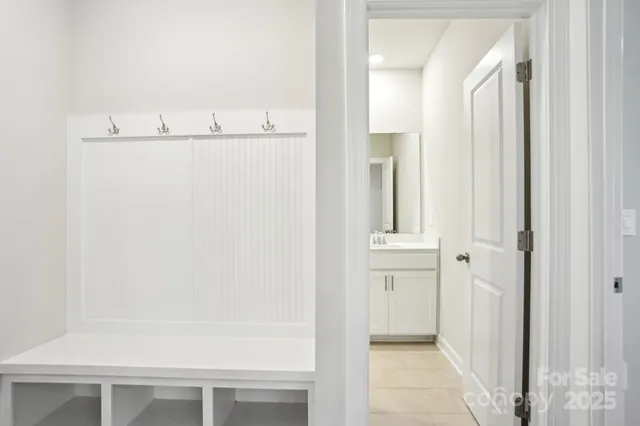 a view of walk in closet with cabinet