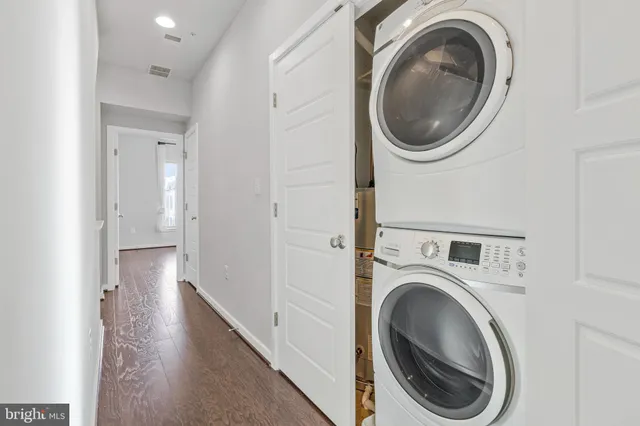 a view of a hallway with washer and dryer