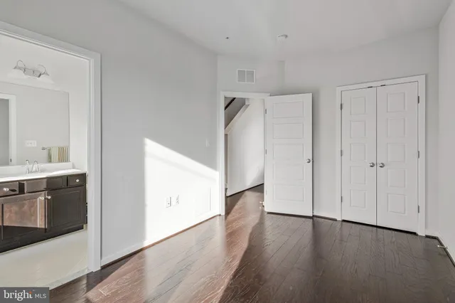 a view of a kitchen with a white cabinet and a stove top oven