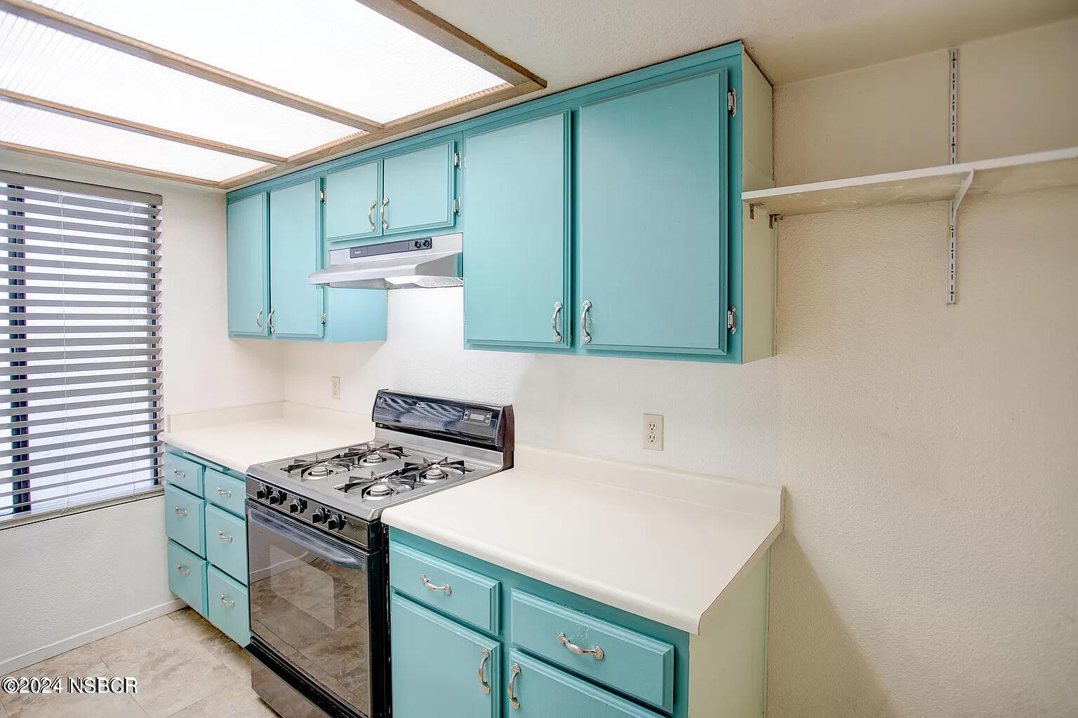 1352 Viola Way Lompoc, CA 93436 - Photo 12 of 30 a kitchen with a stove and a cabinets