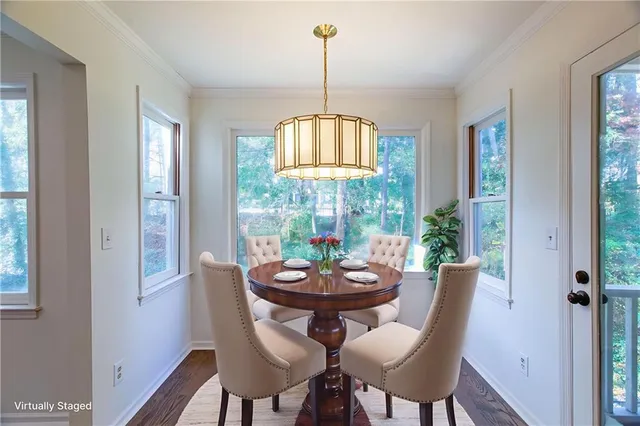 a view of a dining room with furniture window and outside view