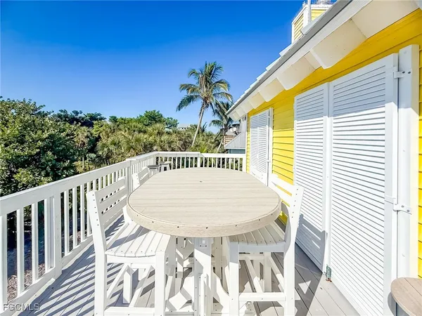 a view of balcony with furniture