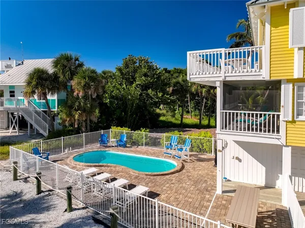 a view of a swimming pool with an outdoor space and seating area