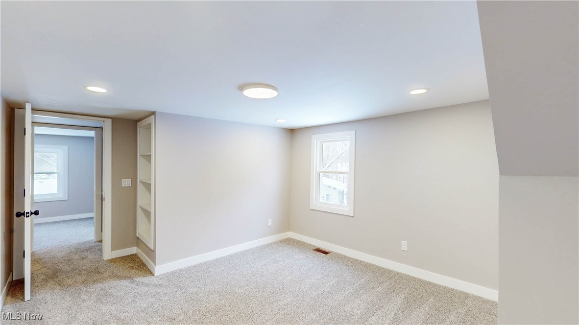 2978 Long Road Uniontown, OH 44685 - Photo 29 of 40 Empty room with light carpet and recessed lighting