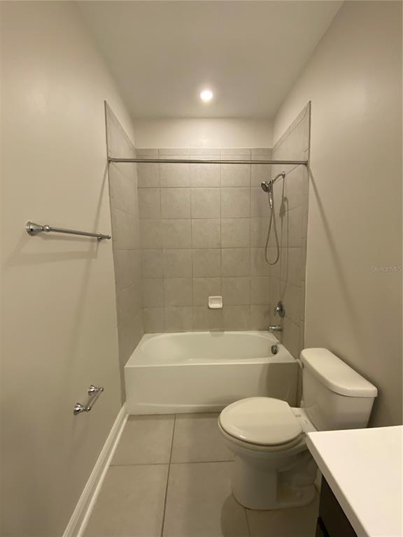 34273 Radley Way Wesley Chapel, FL 33545 - Photo 17 of 38 a bathroom with a toilet and a bathtub