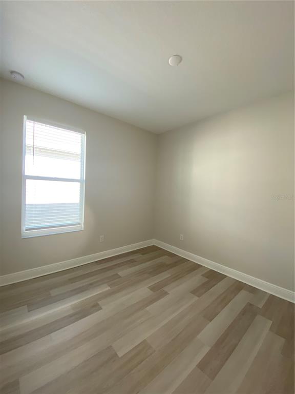 34273 Radley Way Wesley Chapel, FL 33545 - Photo 18 of 38 an empty room with a window