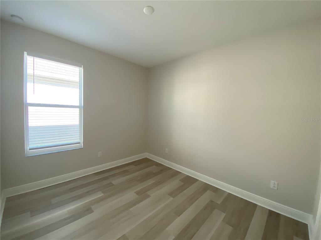 34273 Radley Way Wesley Chapel, FL 33545 - Photo 19 of 38 an empty room with a window