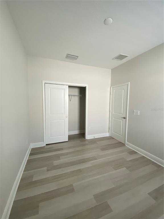 34273 Radley Way Wesley Chapel, FL 33545 - Photo 20 of 38 a view of an empty room with closet and a window