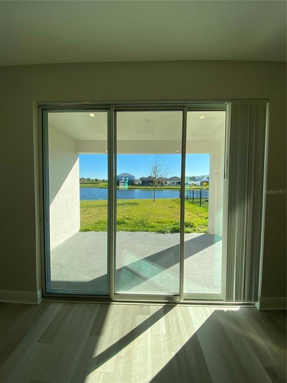 34273 Radley Way Wesley Chapel, FL 33545 - Photo 27 of 38 a view of an empty room with an ocean view