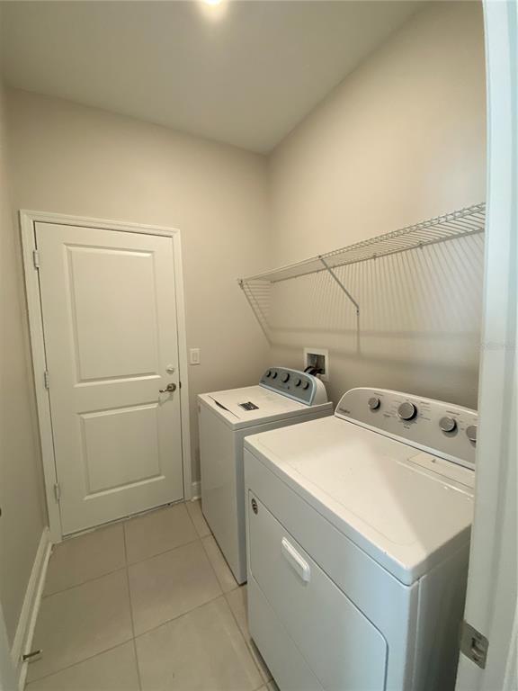 34273 Radley Way Wesley Chapel, FL 33545 - Photo 28 of 38 a utility room with dryer and washer