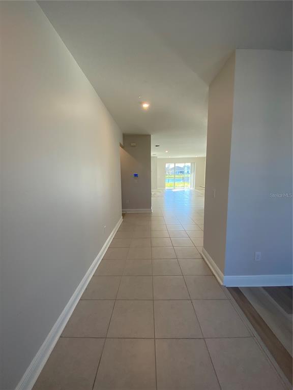 34273 Radley Way Wesley Chapel, FL 33545 - Photo 6 of 38 a view of hallway with window