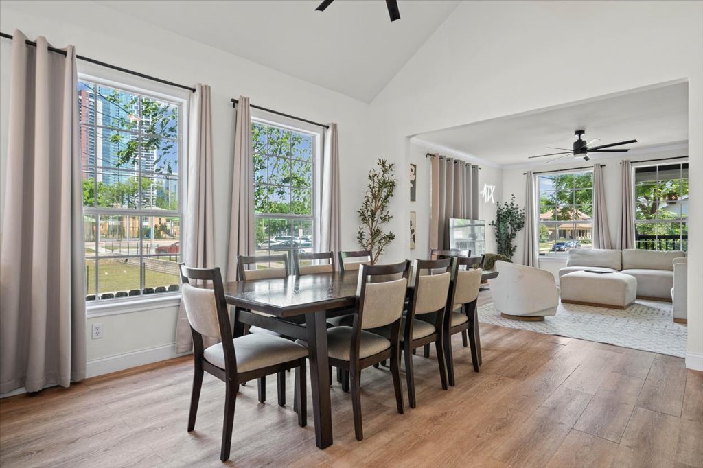 1201 Garden Street, Unit A Austin, TX 78702 - Photo 6 of 30 Dining area featuring wood-finish flooring, a vaulted ceiling, and recessed lighting