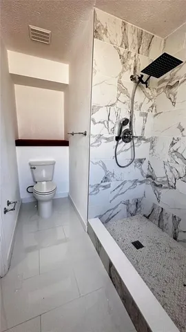 a view of a kitchen with electric appliances