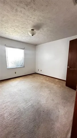 a spacious bathroom with a double vanity sink mirror and a toilet