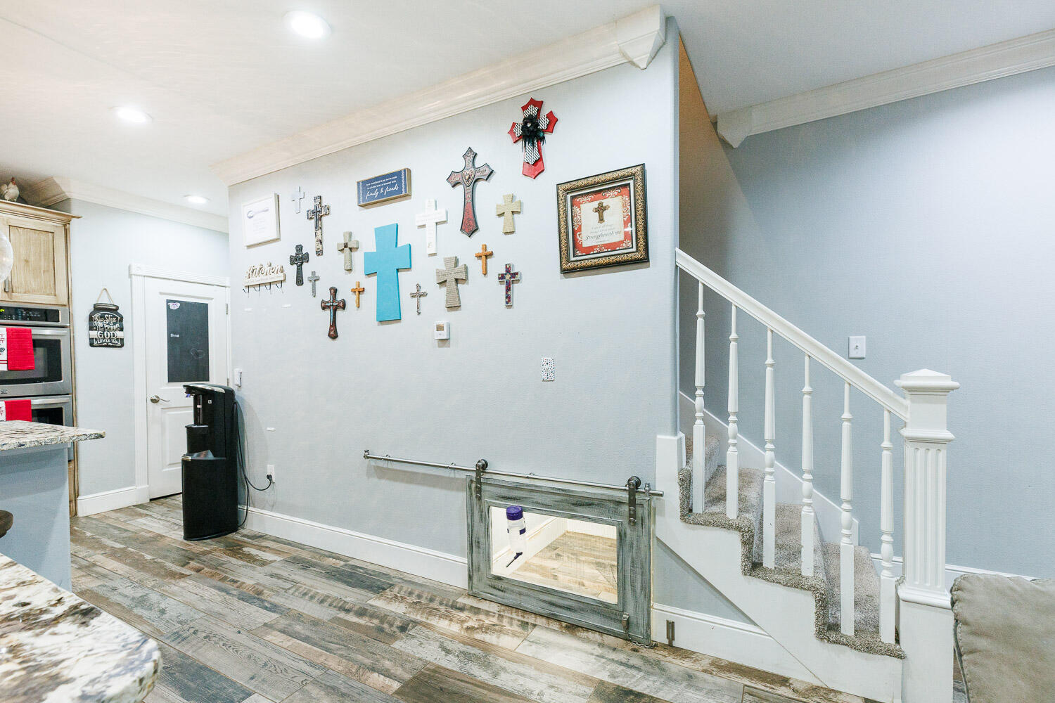 6523 East C R 6200 Lubbock, TX 79403 - Photo 17 of 86 a view of a livingroom with wooden floor and flat screen tv