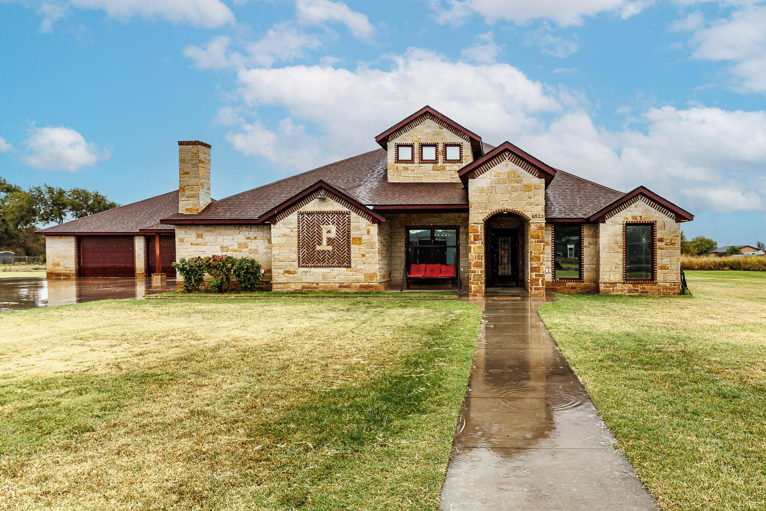 6523 East C R 6200 Lubbock, TX 79403 - Photo 3 of 86 a front view of a house with a yard