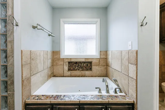 a view of a livingroom with furniture and a flat screen tv
