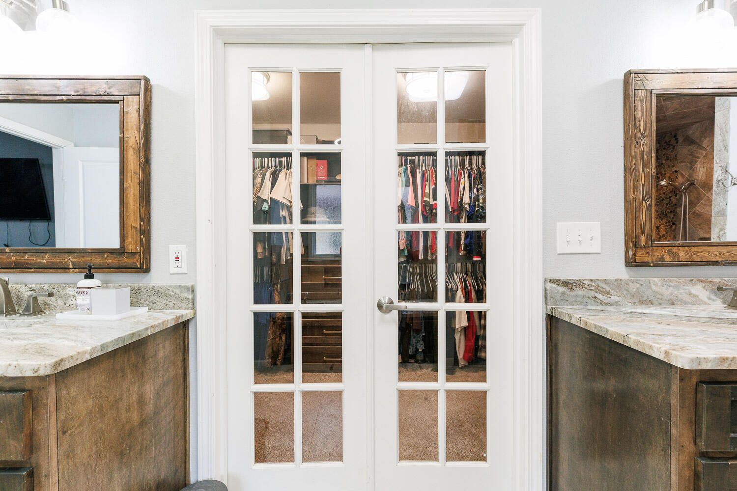 6523 East C R 6200 Lubbock, TX 79403 - Photo 40 of 86 a bathroom with a granite countertop sink and a mirror
