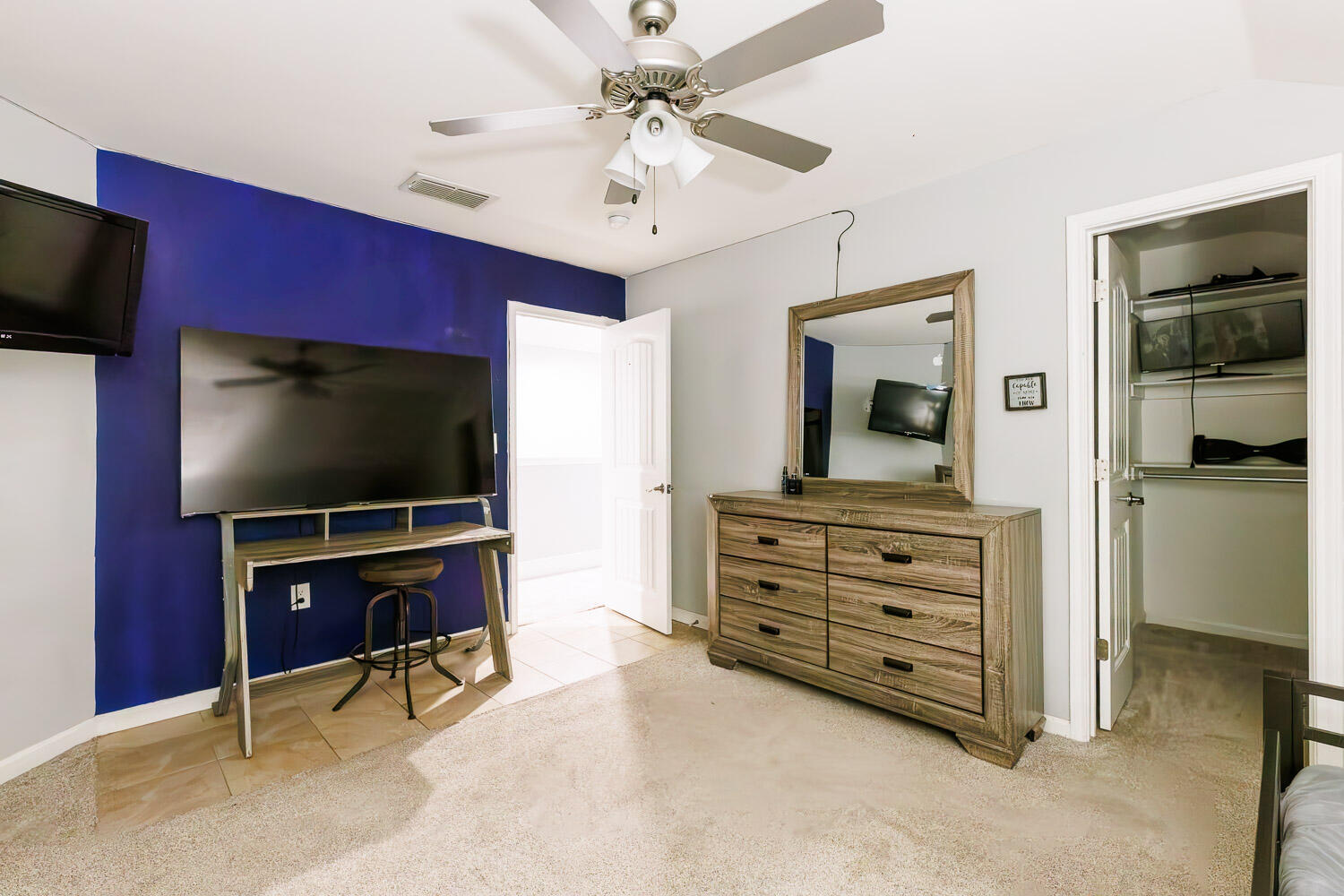 6523 East C R 6200 Lubbock, TX 79403 - Photo 43 of 86 a living room with furniture and a flat screen tv