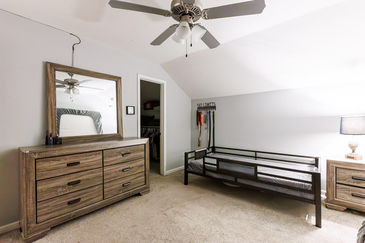 6523 East C R 6200 Lubbock, TX 79403 - Photo 44 of 86 a bedroom with a bed and a dresser