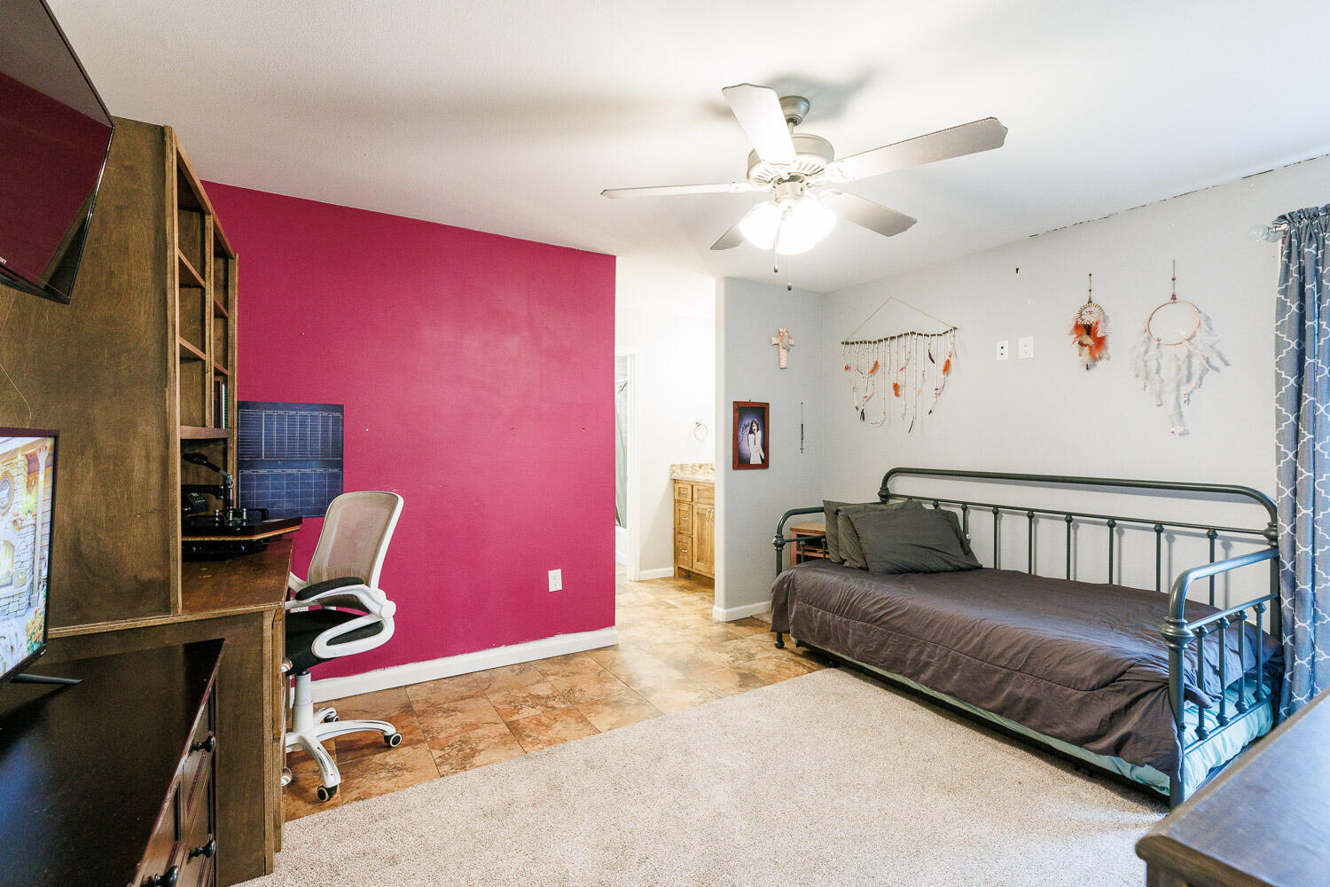 6523 East C R 6200 Lubbock, TX 79403 - Photo 57 of 86 a living room with furniture and a flat screen tv