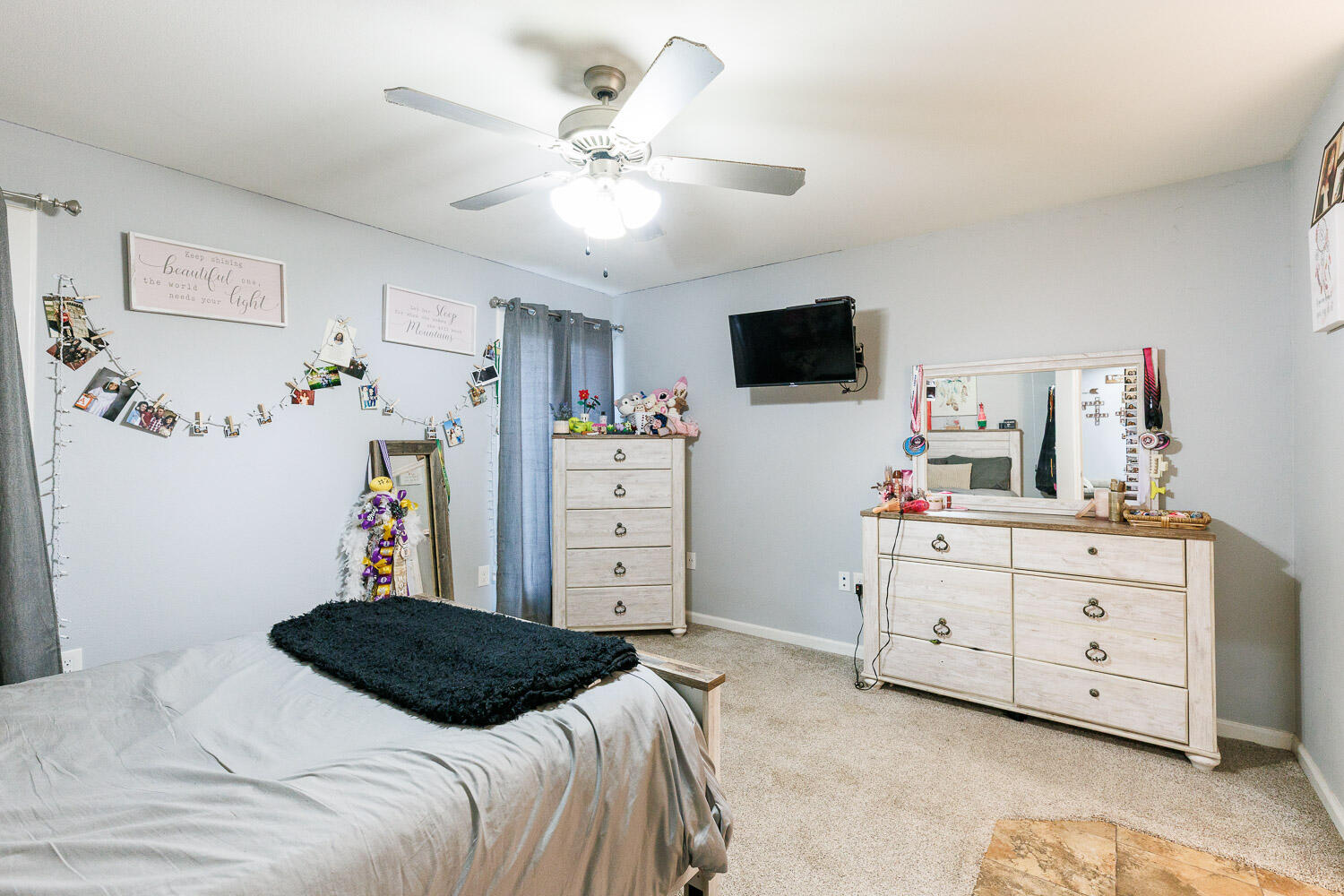 6523 East C R 6200 Lubbock, TX 79403 - Photo 62 of 86 a bedroom with a bed and a flat screen tv in a dresser