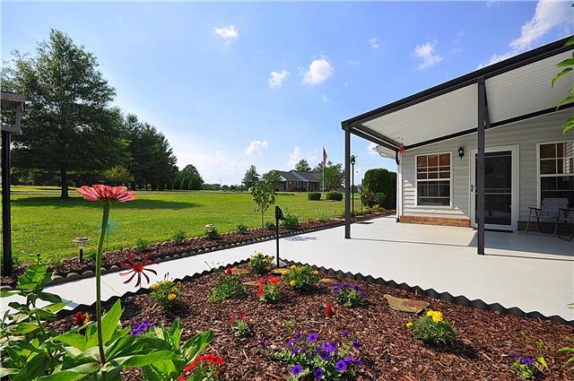 1280 A McCrary Road Lebanon, TN 37090 - Photo 3 of 20 a view of a porch with a table and chairs under an umbrella