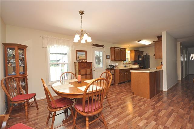 1280 A McCrary Road Lebanon, TN 37090 - Photo 9 of 20 a view of a dining room and livingroom with furniture wooden floor a chandelier