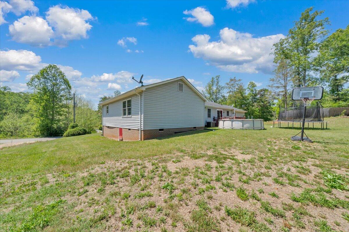 3870 Goose Dam Road Rocky Mount, VA 24151 - Photo 36 of 44 a backyard of a house with lots of green space and garden