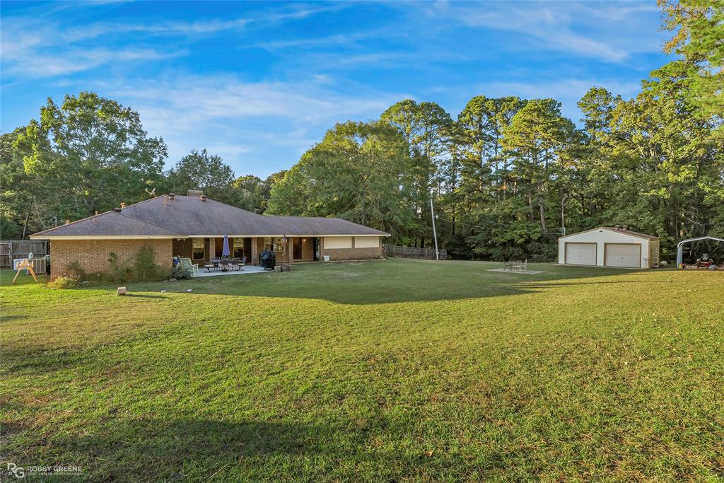 169 Fulbright Circle Minden, LA 71055 - Photo 12 of 38 a front view of a house with a garden