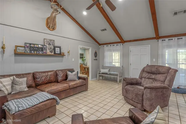 a living room with furniture and a rug