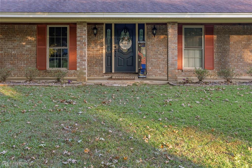 169 Fulbright Circle Minden, LA 71055 - Photo 2 of 38 a view of a house with yard and porch