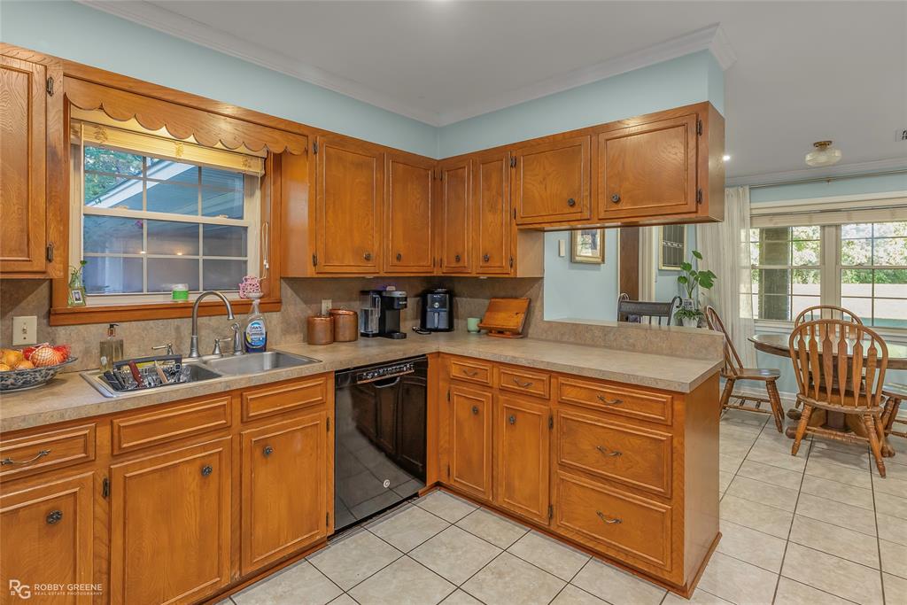 169 Fulbright Circle Minden, LA 71055 - Photo 22 of 38 a kitchen with stainless steel appliances granite countertop a sink and cabinets