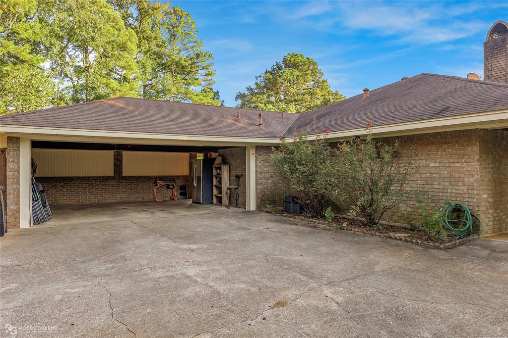 169 Fulbright Circle Minden, LA 71055 - Photo 3 of 38 a backyard of a house with table and chairs