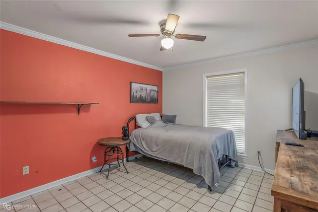 a bedroom with furniture and a chandelier