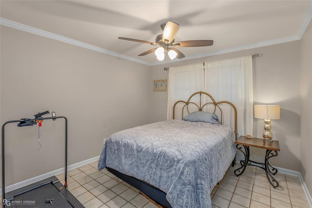 169 Fulbright Circle Minden, LA 71055 - Photo 33 of 38 a bedroom with a bed and a dresser