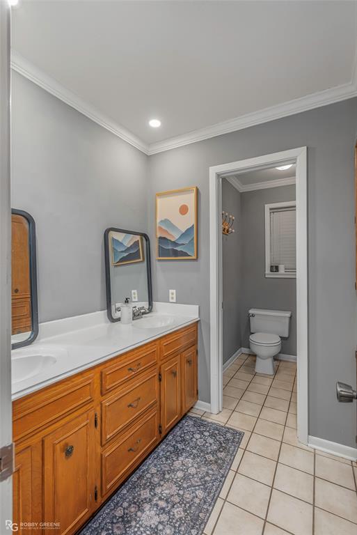 169 Fulbright Circle Minden, LA 71055 - Photo 34 of 38 a spacious bathroom with a toilet sink and mirror