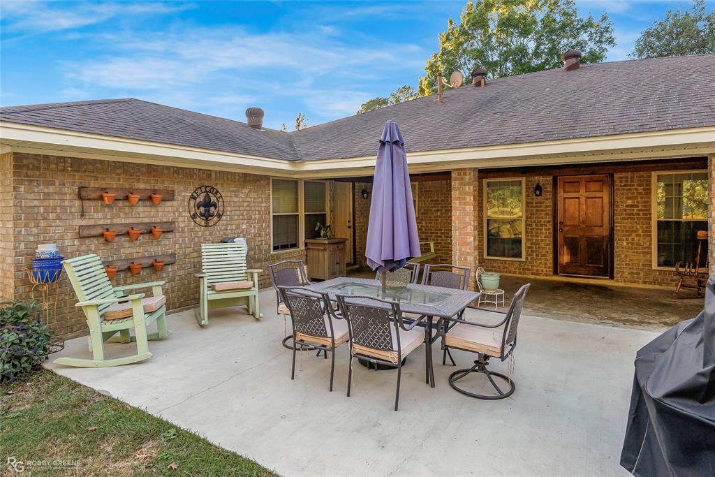 169 Fulbright Circle Minden, LA 71055 - Photo 9 of 38 a view of a patio with table and chairs
