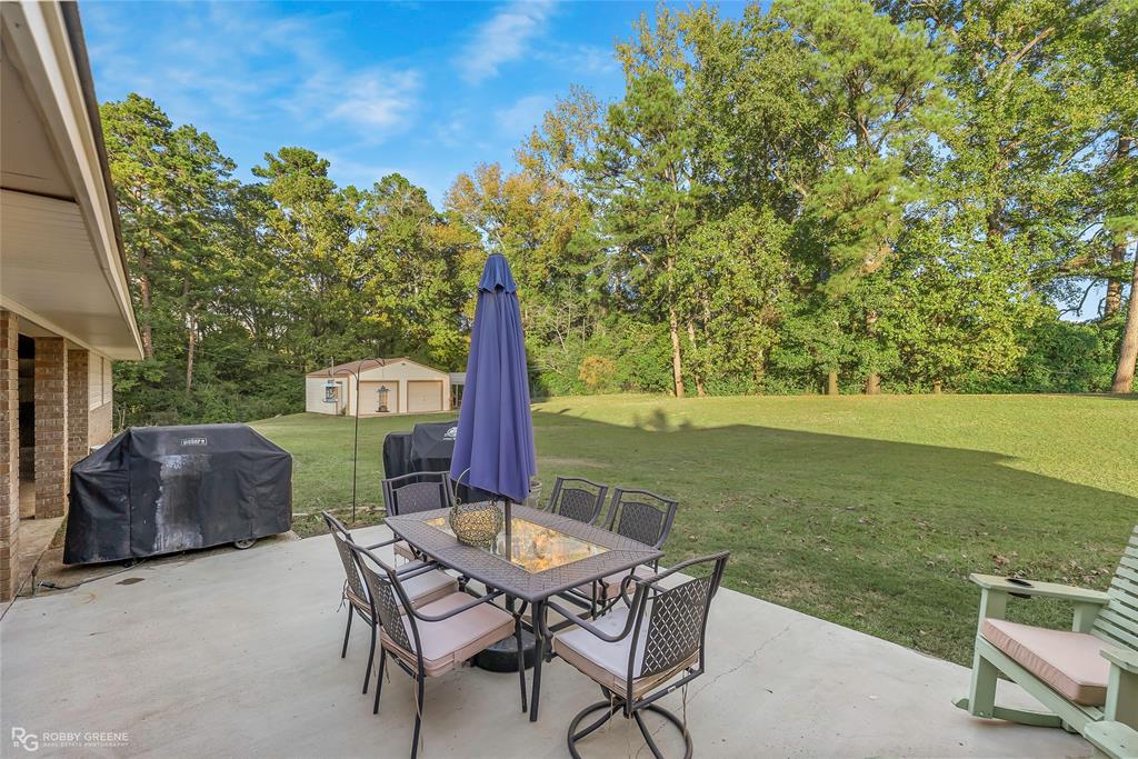 169 Fulbright Circle Minden, LA 71055 - Photo 10 of 38 a view of a chairs and table in patio next to a yard