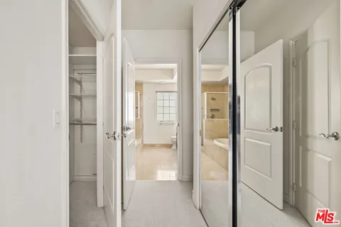 a bathroom with a glass shower door