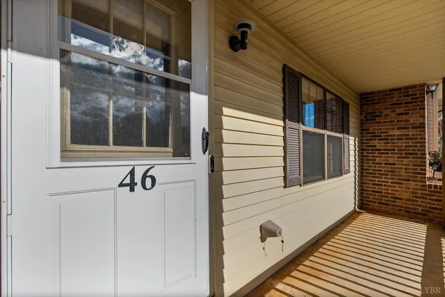 a view of a door and a window
