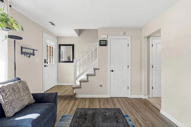 a living room with furniture and a rug