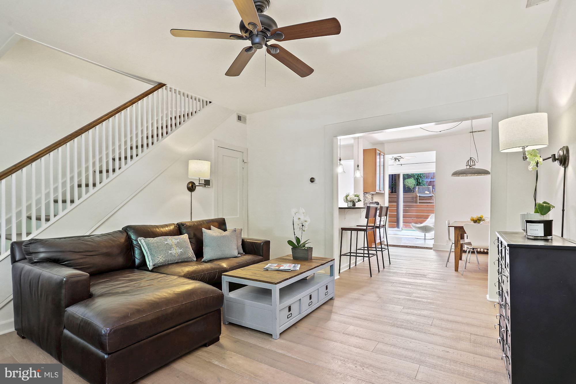 Living room with Kitchen and rear patio