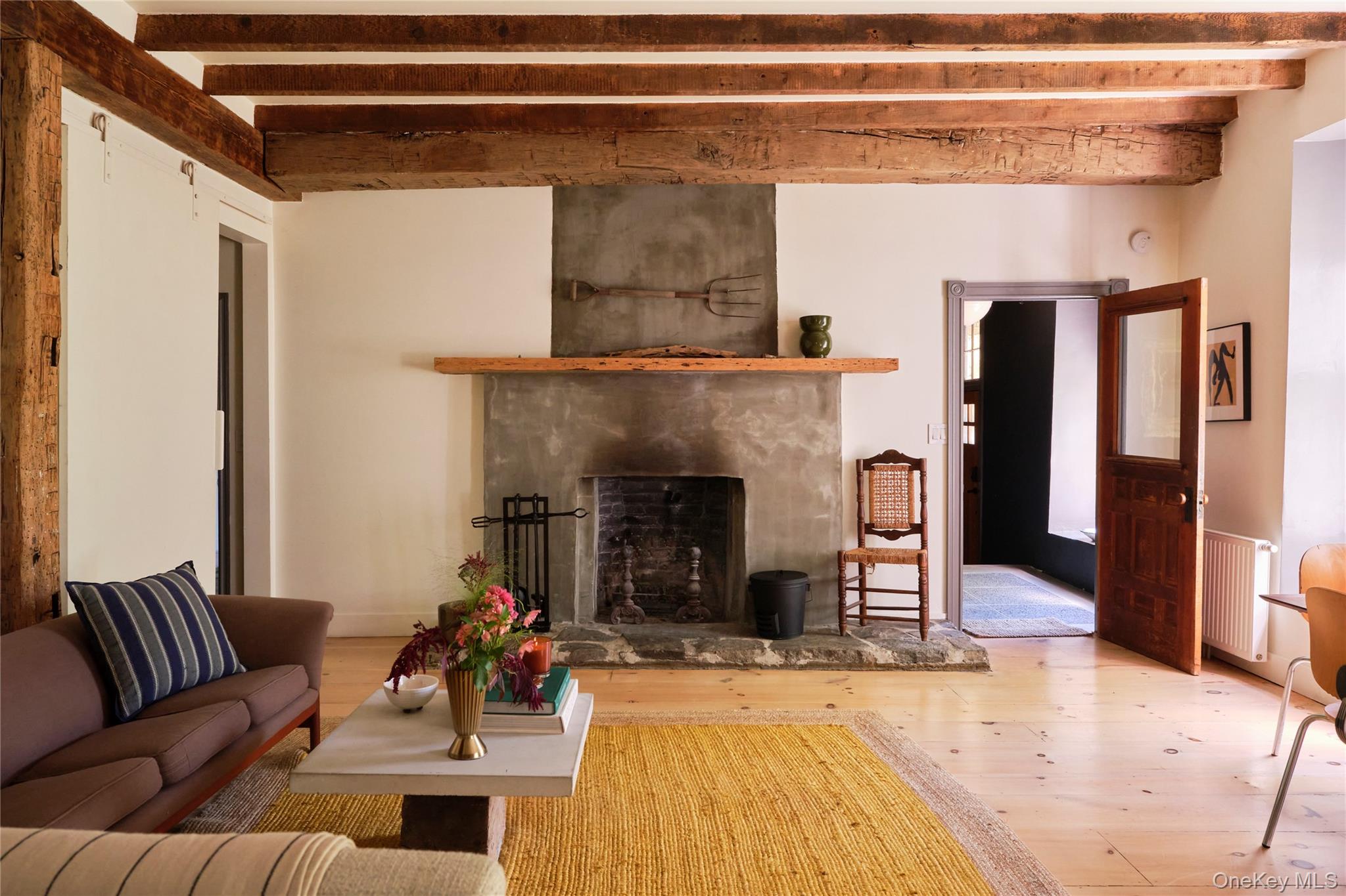1883 Highway 213 Rifton, NY 12471 - Photo 3 of 48 Living area with a premium fireplace, beamed ceiling, radiator, and hardwood / wood-style flooring